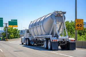 photo of semi-truck pulling a bulk container trailer